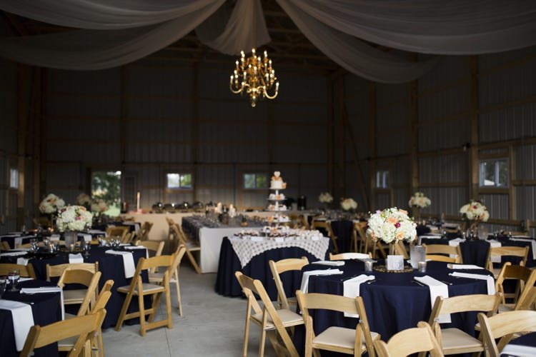 Reception Hanging Chandelier Tulle Navy Blue White Table Settings Flower Centrepieces Country Farm Barn Wedding Ohio http://www.caseyclarkphotography.net/
