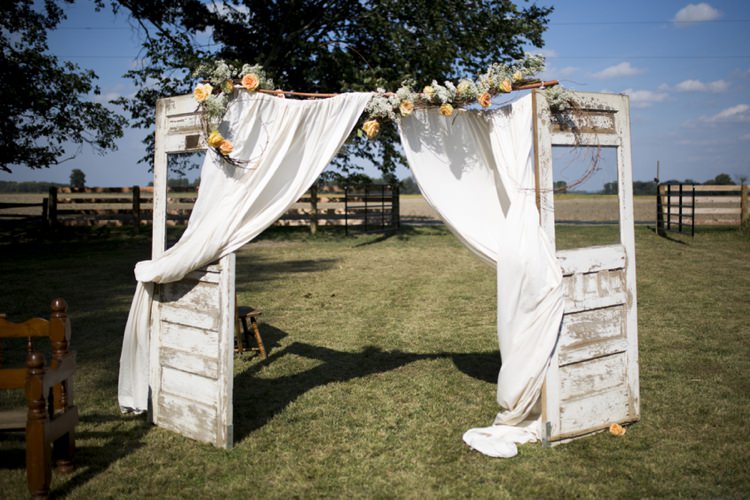 Ceremony Rustic Doors Decor Peach White Flowers Roses Country Farm Barn Wedding Ohio http://www.caseyclarkphotography.net/ 