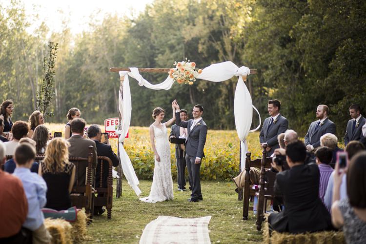 Outdoor Ceremony Arch Flowers Peach Roses White Tulle Hay Bales Bean Field Country Farm Barn Wedding Ohio http://www.caseyclarkphotography.net/