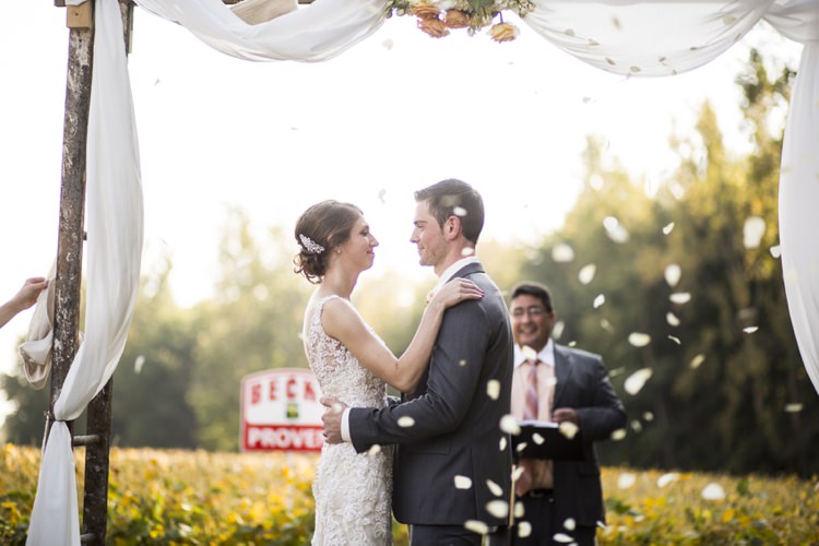 Outdoor Ceremony Flower Petals Arch White Tulle Peach Roses Country Farm Barn Wedding Ohio http://www.caseyclarkphotography.net/ 