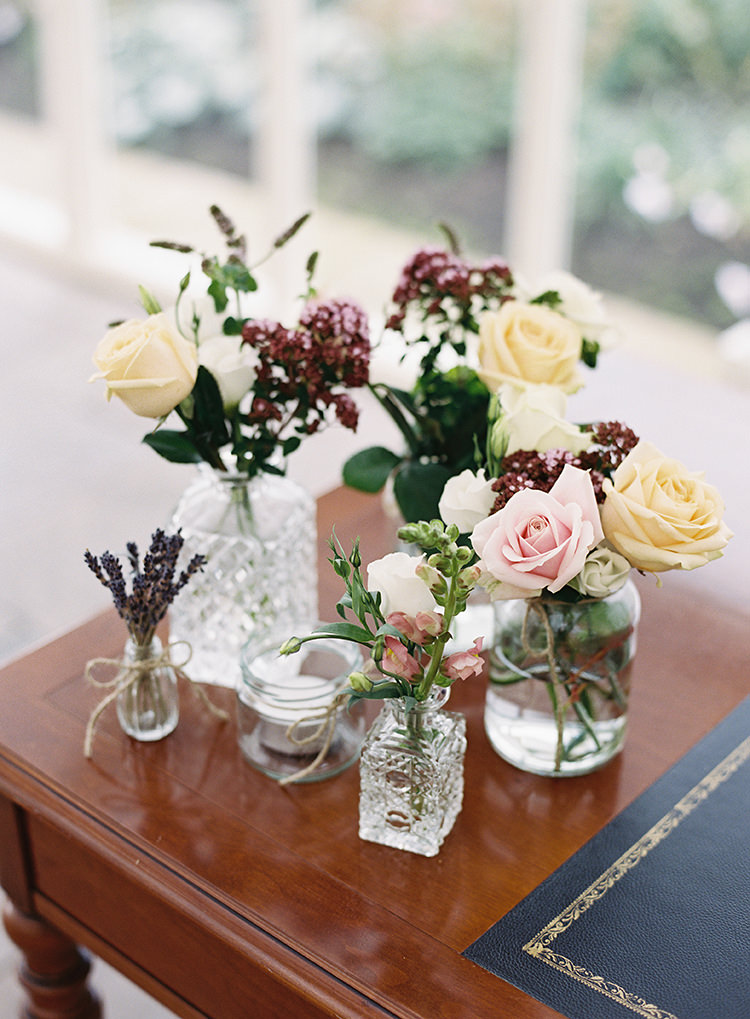 Flowers Bottle Jars Pink Cream Roses Pretty Floral Wonderland DIY Wedding http://www.victoriaphippsphotography.co.uk/