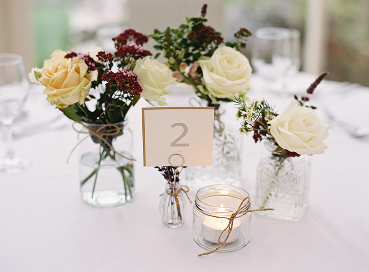 Glass Bottle Jar Flwoers Centrepiece Candle Tea Light Pretty Floral Wonderland DIY Wedding http://www.victoriaphippsphotography.co.uk/