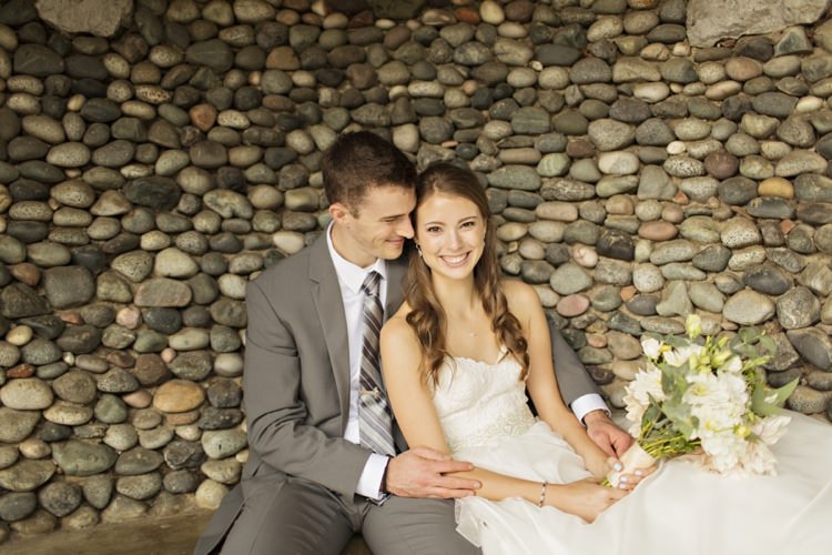Bride Groom Rock Wall Strapless Sweetheart Bridal Gown Peach Pink Dahlia Bouquet Grey Suit Grey Stripe Tie Elegant Classic Outdoor Wedding Washington http://www.courtneybowlden.com/