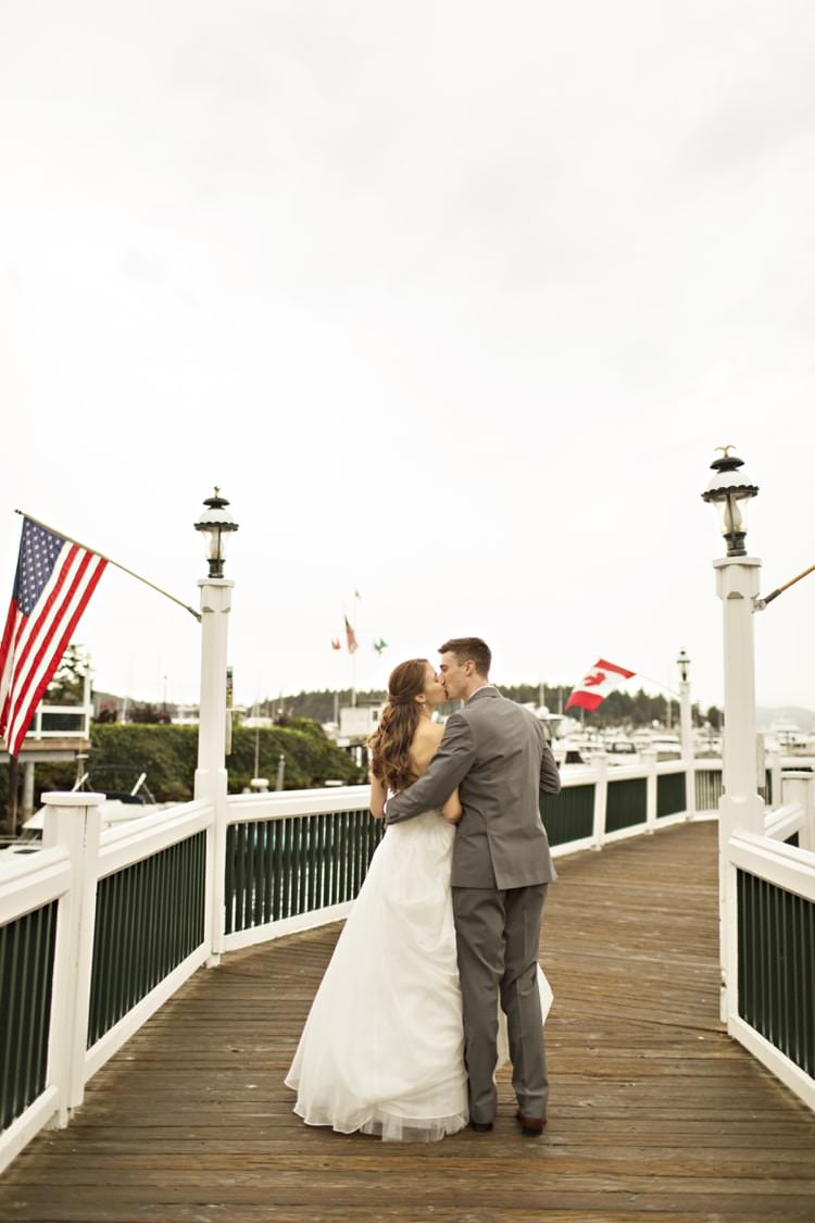 Bride Groom Roche Harbor Resort Marina Strapless Sweetheart Bridal Gown Grey Suit Elegant Classic Outdoor Wedding Washington http://www.courtneybowlden.com/