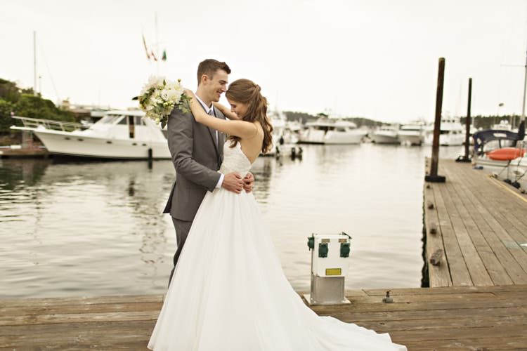 Bride Groom Roche Harbor Resort Marina Strapless Sweetheart Bridal Gown Dahlia Bouquet Groom Grey Suit Elegant Classic Outdoor Wedding Washington http://www.courtneybowlden.com/