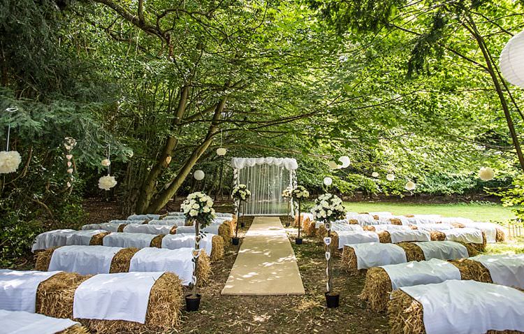 Ceremony Aisle Hay Bales Flowers Pom Poms Outdoor Festival Summer Wedding http://lighteningphotography.co.uk/