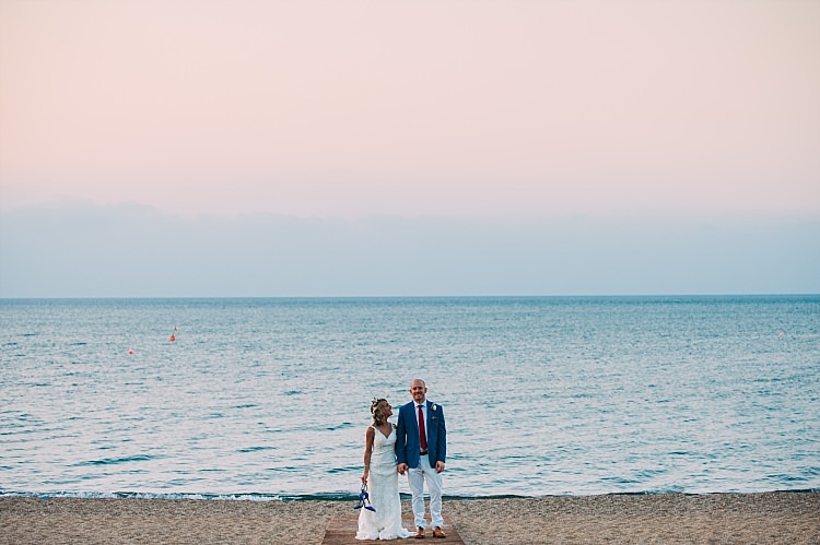 Bride Stella York Lace Gown Groom Royal Blue Coat Red Tie Ocean Sunset Beautiful Traditional Greek Destination Wedding in Cyprus http://www.jonnybarratt.com/