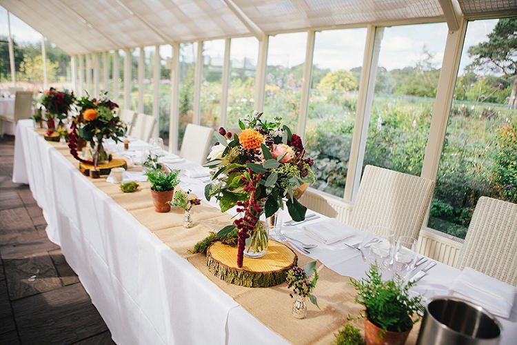 Top Table Log Slice Flowers Hessian Burlap Rustic Woodland Floral Wedding http://kellyjphotography.co.uk/