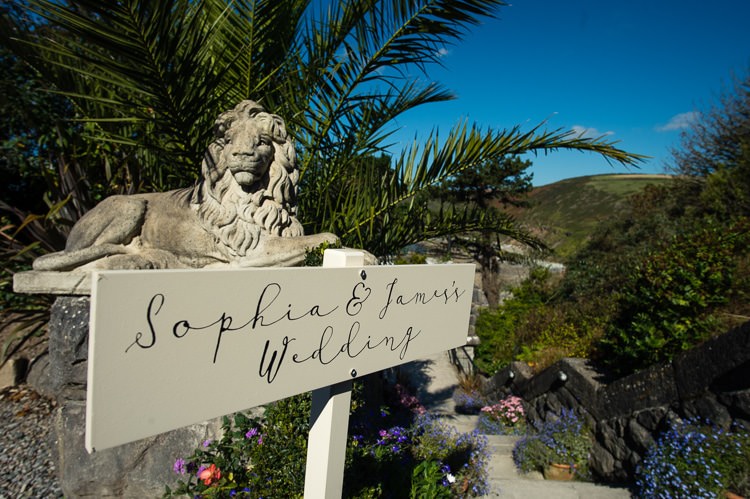Wooden Calligraphy Sign Post Beautiful Cliffside Floral Wedding http://karibellamy.com/
