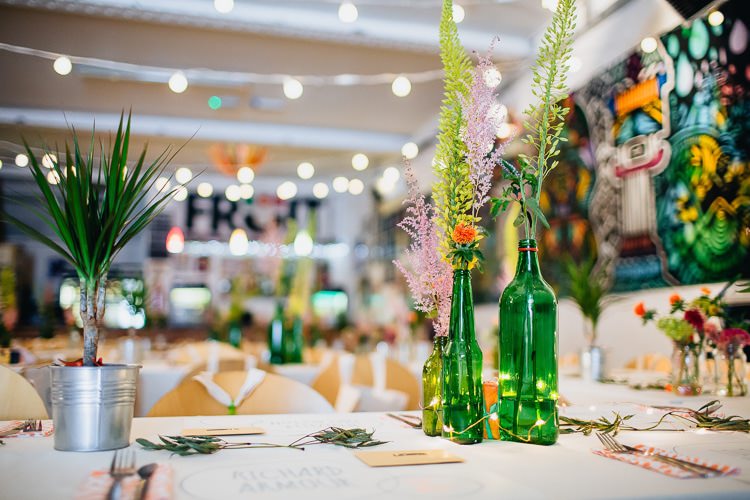 Bottle Flowers Creative Warehouse Eclectic Wedding http://sarahbethphoto.co.uk/