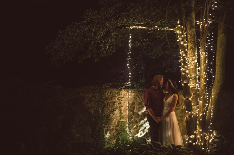 Bride Lace V Neck Bridal Gown Flower Crown Groom Maroon Shirt Outdoors Fairy Lights Trees Hippy Bohemian Outdoorsy Wedding in Pennsylvania http://tylerboye.com/