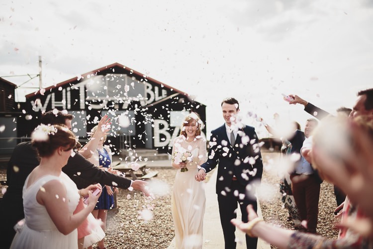 Confetti Throw Bride Groom Free Spirited Beautiful Beach Wedding https://www.paulfullerkentphotography.com/