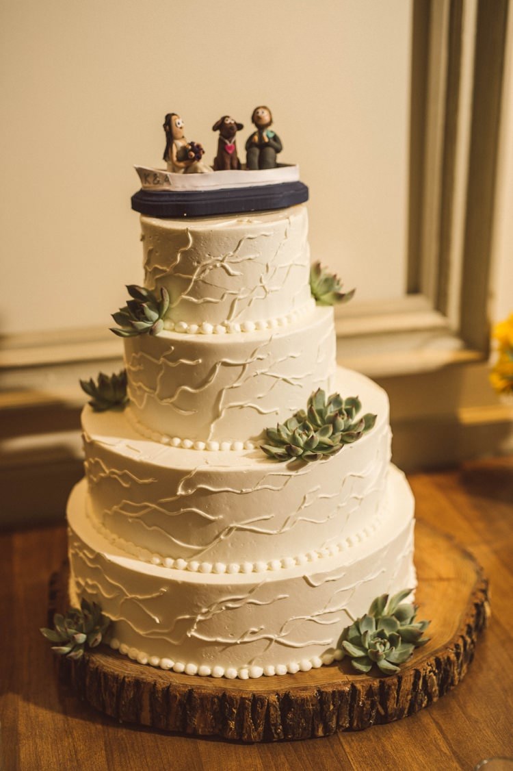 Wedding Cake Cream Green Flowers Figurine Topper Couple Dog Wooden Stand Hippy Bohemian Outdoorsy Wedding in Pennsylvania http://tylerboye.com/