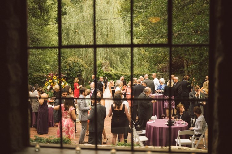 Reception Cocktail Hour Outdoors Trees Guests Purple Tablecloths Window Hippy Bohemian Outdoorsy Wedding in Pennsylvania http://tylerboye.com/