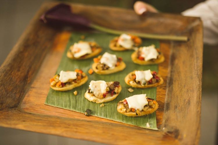 Reception Wooden Tray Purple Flower Canapés Hippy Bohemian Outdoorsy Wedding in Pennsylvania http://tylerboye.com/