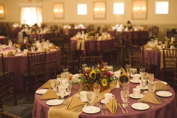 Reception Table Setting Purple Tablecloth Floral Centrepiece Sunflowers Maroon Greenery Gold Hippy Bohemian Outdoorsy Wedding in Pennsylvania http://tylerboye.com/