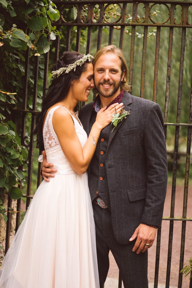 Bride Lace V Neck Bridal Gown Flower Crown Groom Grey Suit Maroon Shirt Belt Buckle Outdoors Gate Hippy Bohemian Outdoorsy Wedding in Pennsylvania http://tylerboye.com/