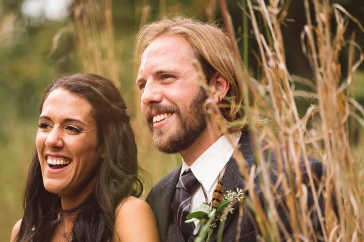 Bride Loose Curls Braid Hairstyle Groom Grey Suit Tie Feather Greenery Button Hole Outdoors Hippy Bohemian Outdoorsy Wedding in Pennsylvania http://tylerboye.com/