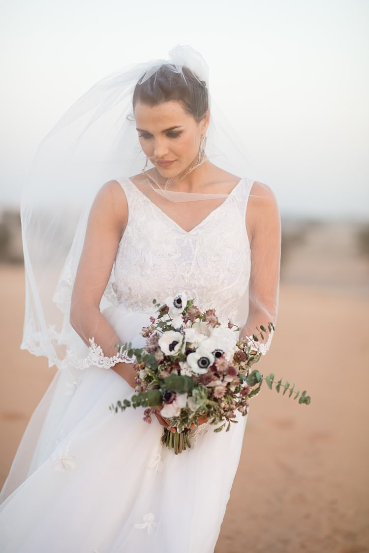 Bride V Neck Bridal Gown Lace Veil Bouquet White Anemone Flowers Pink Green Sand Geometric Desert Dubai Wedding Ideas http://weddingphotographerdubai.me/