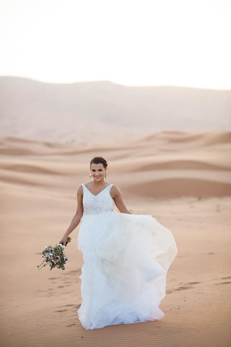Bride V Neck Bridal Gown Bouquet White Anemone Flowers Sand Hills Geometric Desert Dubai Wedding Ideas http://weddingphotographerdubai.me/