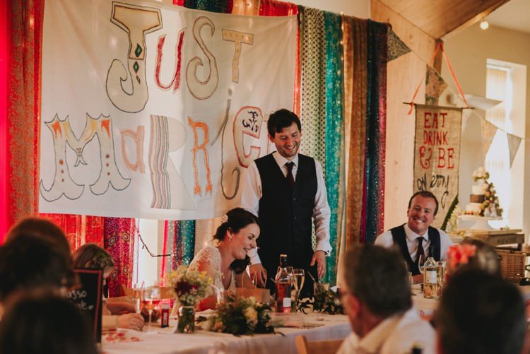 Just Married Top Table Backdrop Sign Whimsical Bright Village Hall Wedding http://www.beckyryanphotography.co.uk/
