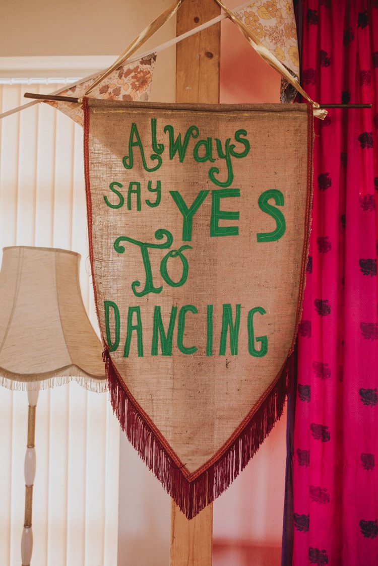 Dancing Banner Fabric Tassel Whimsical Bright Village Hall Wedding http://www.beckyryanphotography.co.uk/