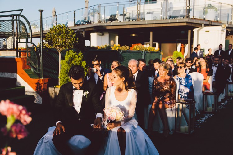 Outdoor Ceremony Groom Bride Sunset Bouquet Guests Modern Roof Terrace Dusk Wedding Madrid http://www.lorenasanjose.com/