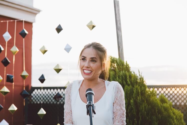 Bride Three Piece Bridal Gown Low Back Lace Ponytail Hairstyle Hanging Décor Greenery Sunset Modern Roof Terrace Dusk Wedding Madrid http://www.lorenasanjose.com/