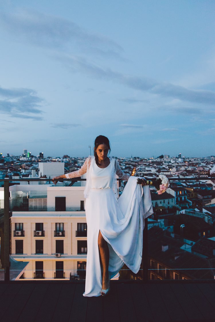 Bride Three Piece Bridal Gown Low Back Lace Metallic Heels Bouquet City Views Modern Roof Terrace Dusk Wedding Madrid http://www.lorenasanjose.com/