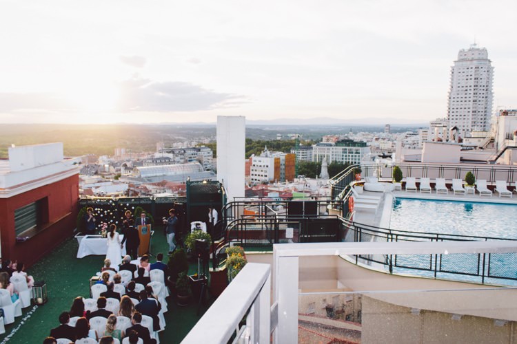 Outdoor Ceremony Bride Groom Guests City Views Pool Sunset Modern Roof Terrace Dusk Wedding Madrid http://www.lorenasanjose.com/