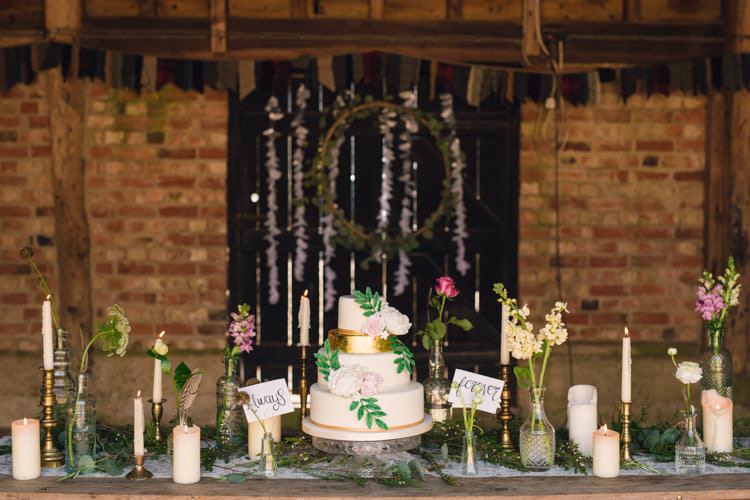 Cake Table Flowers Bottles Feathers Candles Table Decor Boho Blossom Summer Wedding Ideas http://www.catlaneweddings.com/