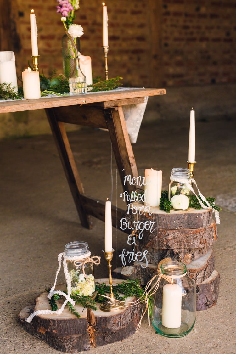 Cake Table Flowers Bottles Feathers Candles Table Decor Logs Sign Glass Menu Boho Blossom Summer Wedding Ideas http://www.catlaneweddings.com/