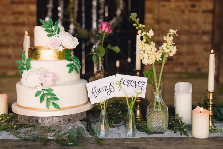 Cake Table Flowers Bottles Feathers Candles Table Decor Boho Blossom Summer Wedding Ideas http://www.catlaneweddings.com/