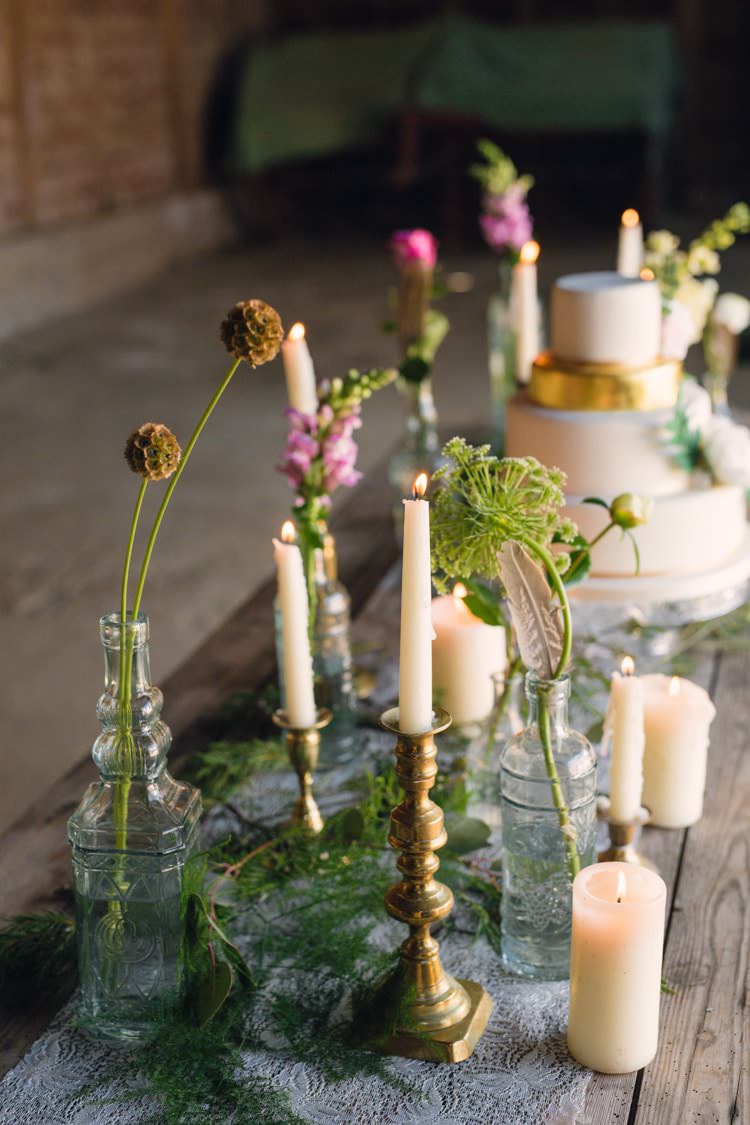 Cake Table Flowers Bottles Feathers Candles Table Decor Boho Blossom Summer Wedding Ideas http://www.catlaneweddings.com/