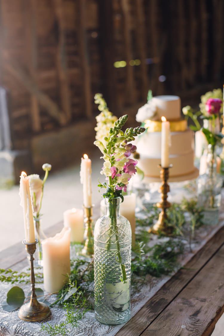 Cake Table Flowers Bottles Feathers Candles Table Decor Boho Blossom Summer Wedding Ideas http://www.catlaneweddings.com/