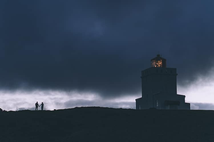 Bride Groom Silhouette Dark Clouds Lighthouse Glacier Lagoon Iceland Anniversary Shoot http://marcsmithphotography.com/