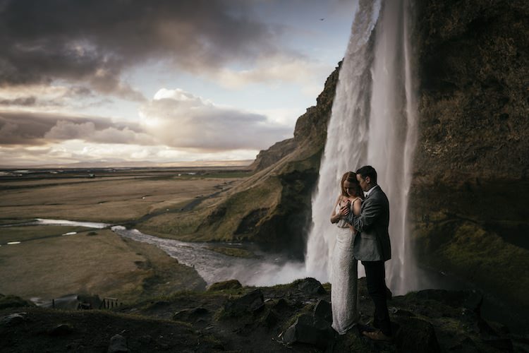 Bride Groom Waterfall Rocks Clouds Glacier Lagoon Iceland Anniversary Shoot http://marcsmithphotography.com/
