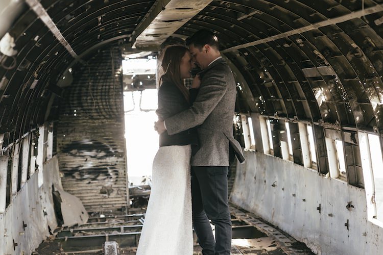 Bride Beaded Stephanie Allin Bridal Gown Groom Grey Tweed Jacket Skinny Jeans Plane Wreck Sunlight Glacier Lagoon Iceland Anniversary Shoot http://marcsmithphotography.com/