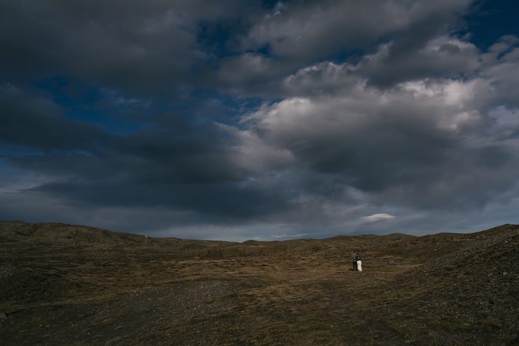 Bride Groom Landscape Grey Clouds Brown Hills Glacier Lagoon Iceland Anniversary Shoot http://marcsmithphotography.com/