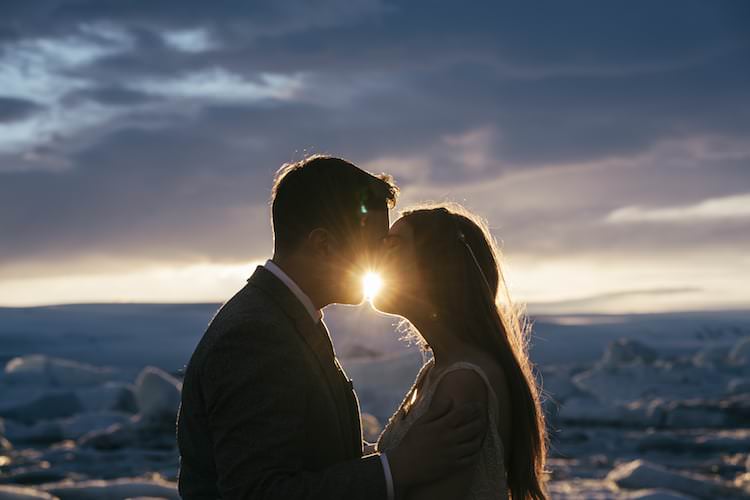 Sunset Bride Groom Kiss Ice Clouds Snow Glacier Lagoon Iceland Anniversary Shoot http://marcsmithphotography.com/
