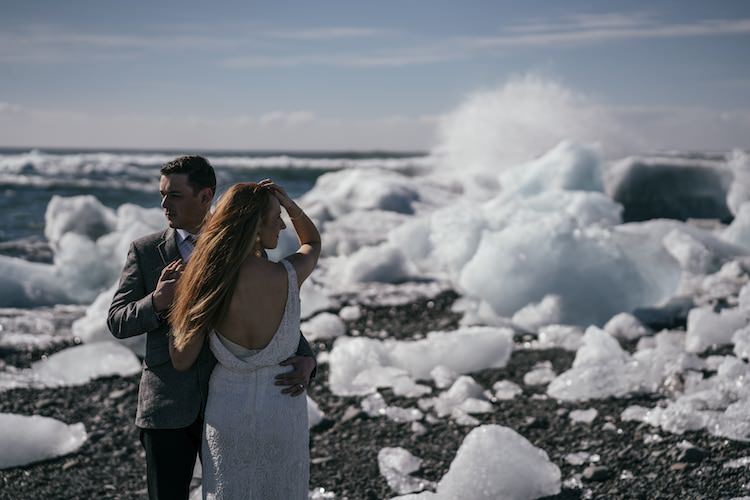 Bride Beaded Low Back Stephanie Allin Bridal Gown Gold Drop Earrings Groom Grey Tweed Jacket Skinny Jeans Ice Cold Blue Sky Glacier Lagoon Iceland Anniversary Shoot http://marcsmithphotography.com/