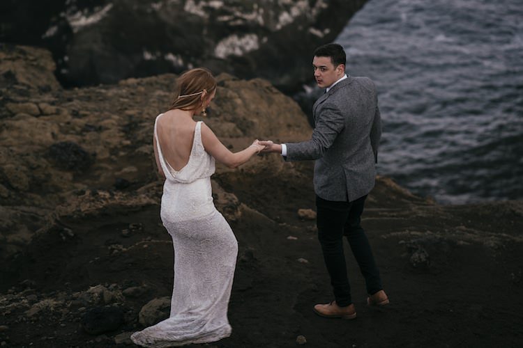 Bride Stephanie Allin Beaded Low Back Bridal Gown Groom Grey Tweed Jacket Skinny Jeans Cliff Ocean Glacier Lagoon Iceland Anniversary Shoot http://marcsmithphotography.com/