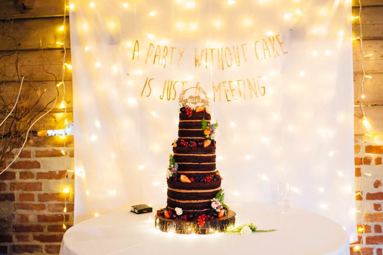 Cake Chocolate Naked Fairylights Banner Backdrop Quirky Colourful Relaxed Fun Barn Wedding http://www.lushimaging.com/