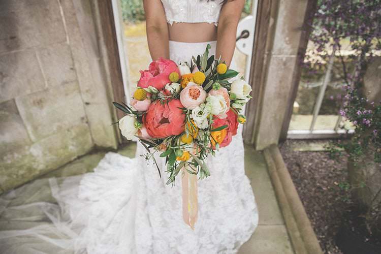 Whimsical Bouquet Coral Peony Peonies Billy Ball Yellow Ribbons Wild Flowers Bride Bridal Playful Peach Wedding Ideas http://www.kelleequinnphotography.com/