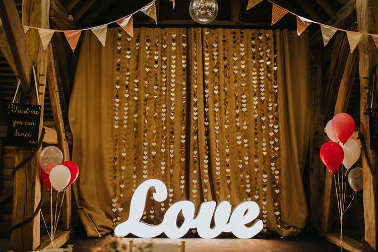 LOVE Letter Lights Paper Heart Backdrop Bunting Balloons Magical Spring Barn Wedding http://www.ireneyapweddings.com/