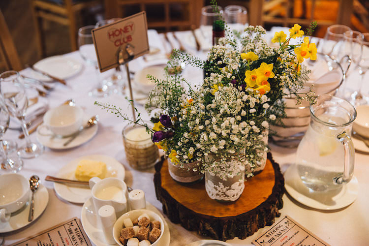 Jar Flowers Lace Log Centrepiece Decor Table Vintage Sports Rustic Yellow Barn Wedding http://www.redonblonde.com/