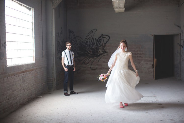 First Look Groom White Shirt Suspenders Black Tie Jeans Bride Cap Sleeve Beaded Bridal Gown Veil Pink Shoes Felt Floral Bouquet Artistic Whimsical Woodland Wedding http://www.adlivcollective.com/