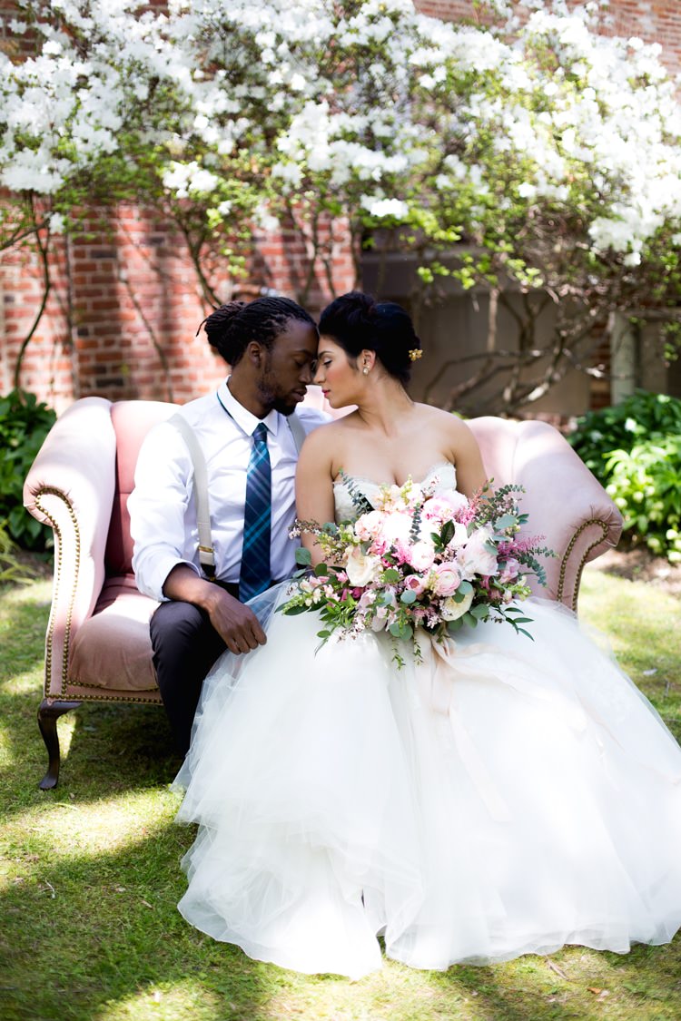 Groom Blue Striped Tie Suspenders Bride Strapless Lace Tulle Gown Pink Green Bouquet Peonies Tea Roses Eucalyptus Florals Blush Sofa Outdoors Azaleas Romantic Vintage Wedding Ideas http://katymurrayphotography.com/