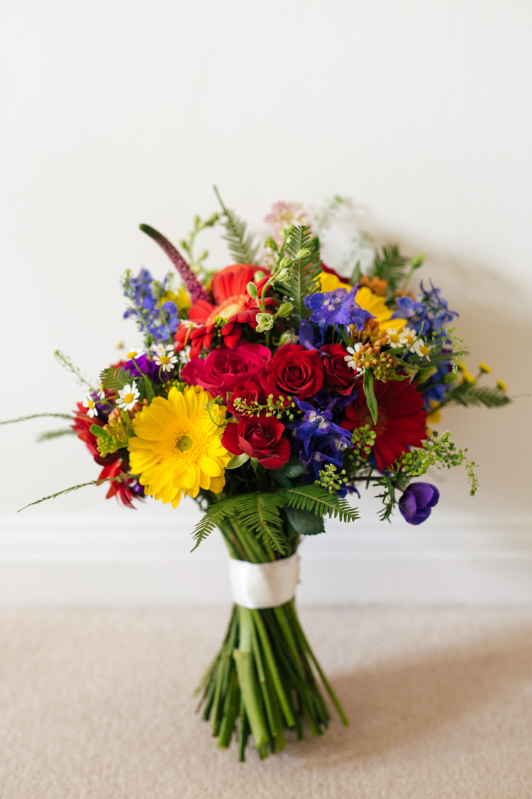 Bouquet Flowers Bride Bridal Rainbow Roses Gerbera Red Yellow Blue Multicoloured Fun Creative Wedding http://www.catlaneweddings.com/