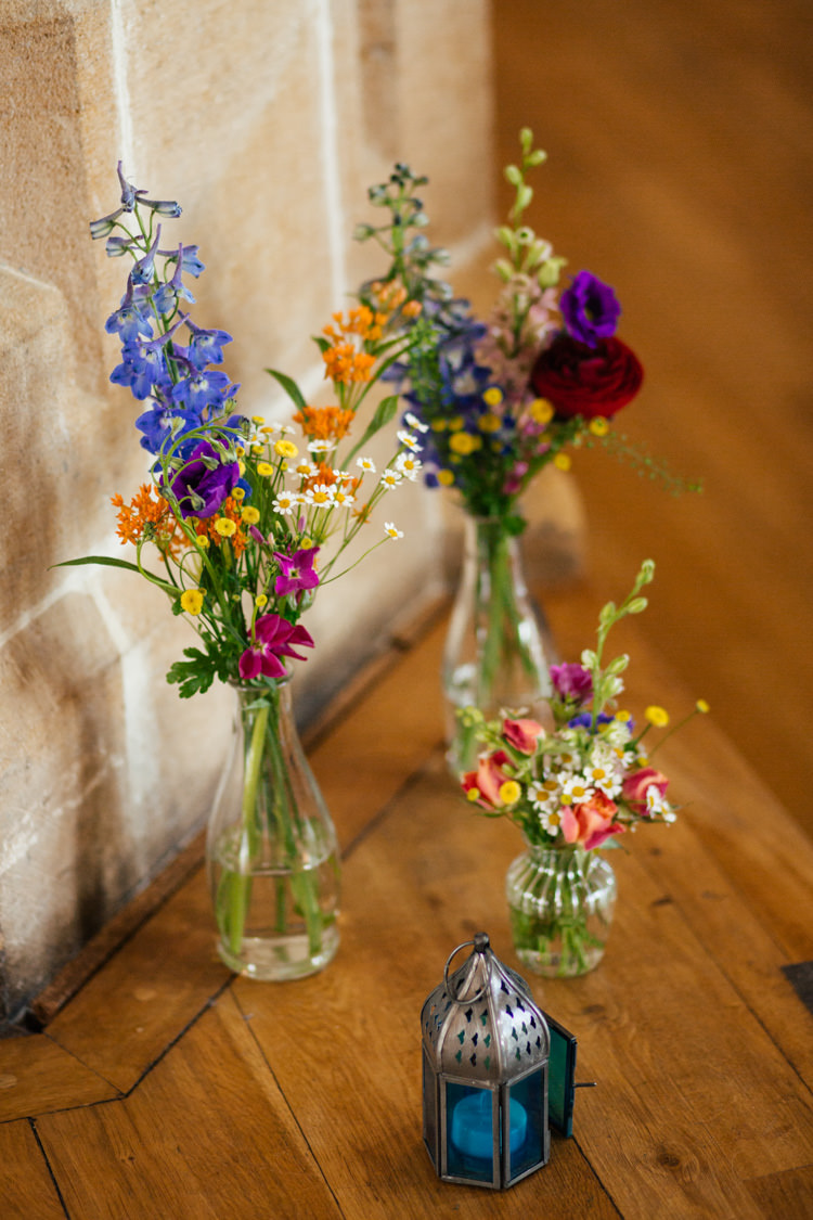 Rainbow Colourful Bottle Flowers Wild Natural Decor Multicoloured Fun Creative Wedding http://www.catlaneweddings.com/
